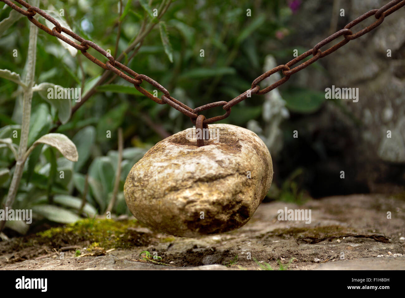 Gravity gate closing device / Stone gate closer Stock Photo Alamy