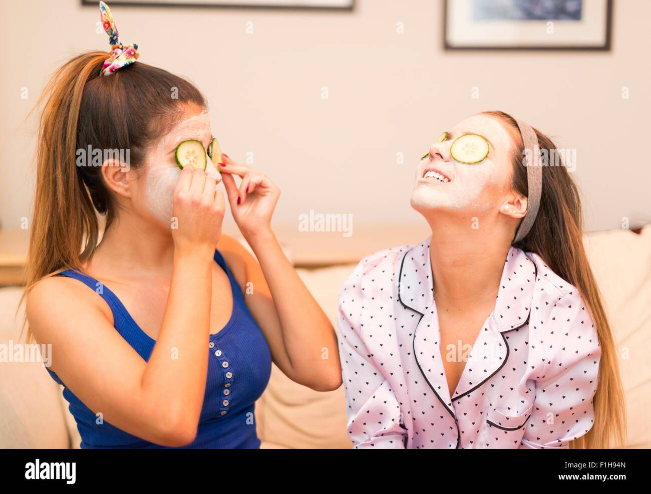 Two young women wearing face masks Stock Photo - Alamy
