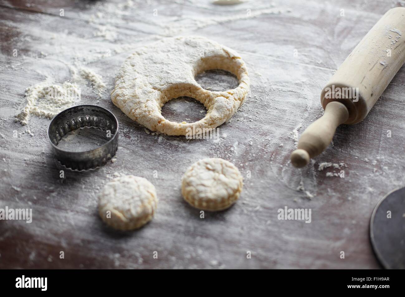Baking preparation with scone dough and pastry cutters Stock Photo