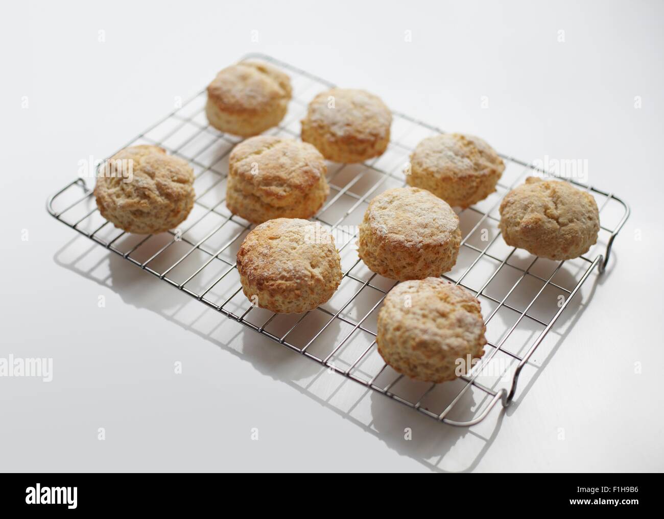 Freshly baked scones on cooling rack Stock Photo