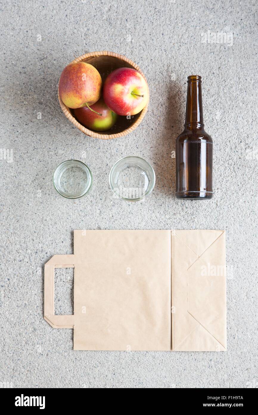 Overhead still life of apples, recyclable bag and bottle Stock Photo