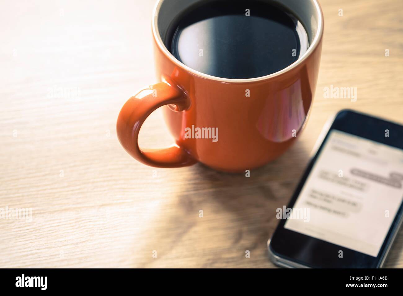 Close up still life of black coffee and smartphone Stock Photo