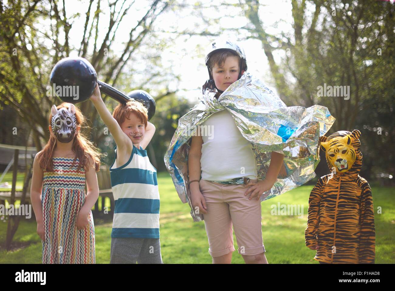 Portrait of young children wearing fancy dress, outdoors Stock Photo