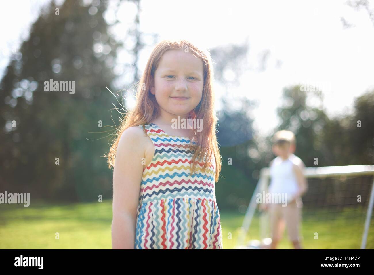 Portrait of young girl in garden Stock Photo - Alamy