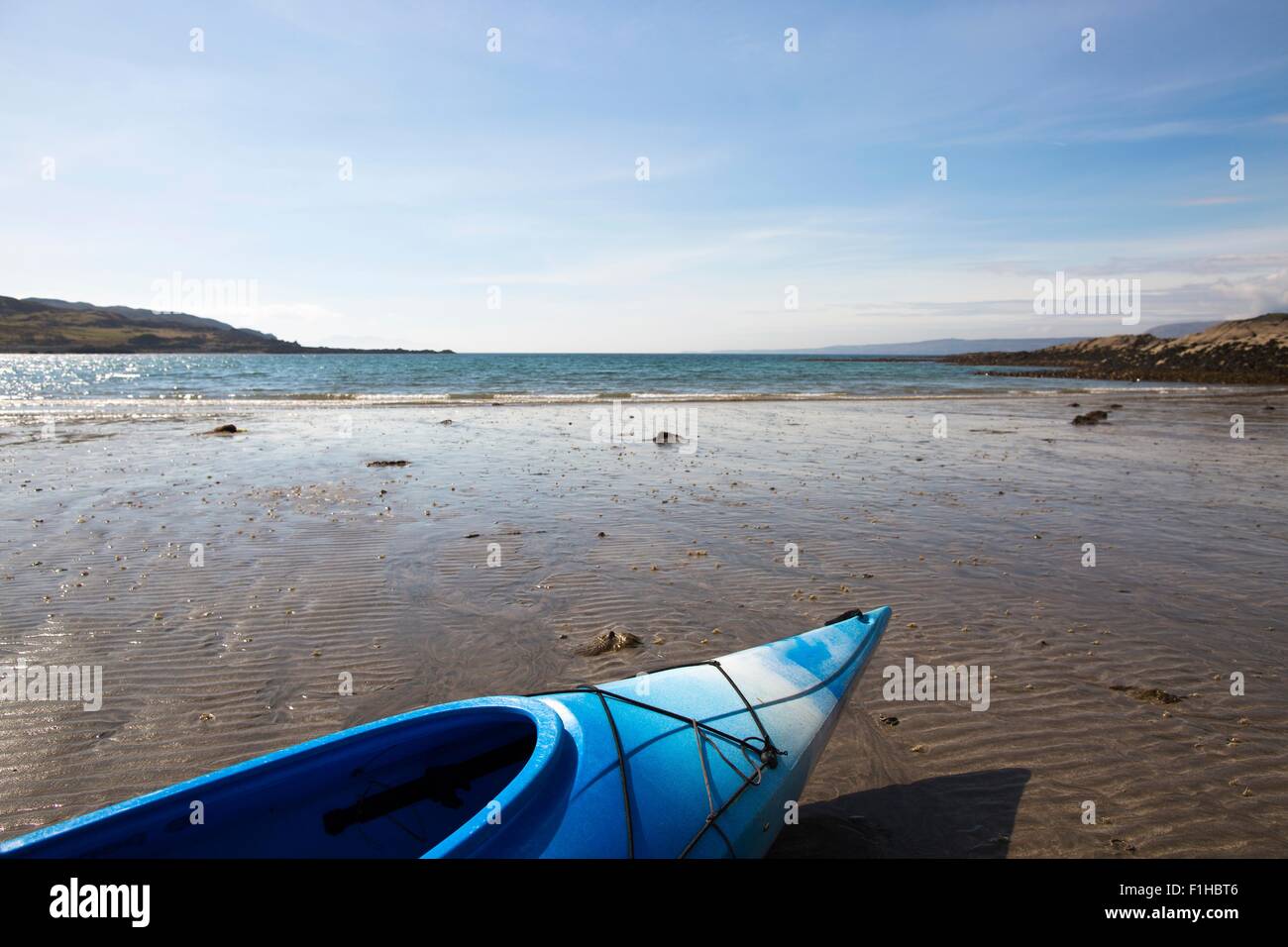 Blue canoe on beach, Loch Eishort, Isle of Skye, Hebrides, Scotland