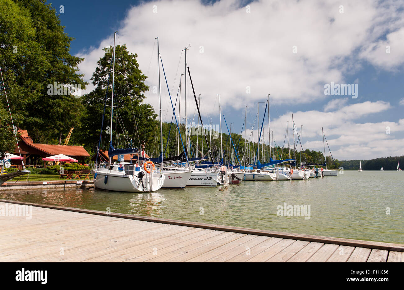 Berthed sailing boats row calming view Stock Photo - Alamy
