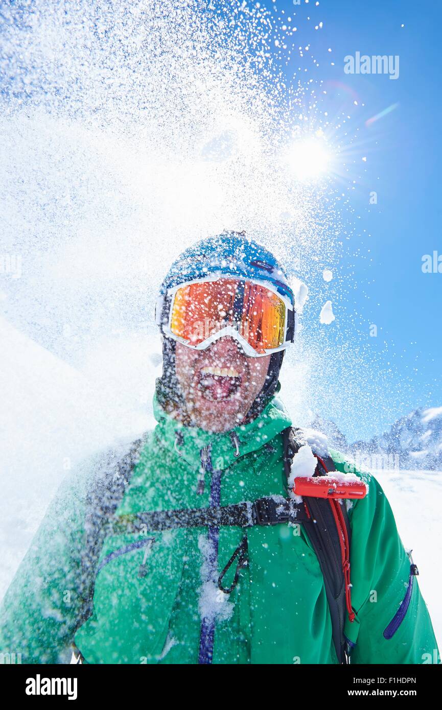 Portrait of mature male skier covered in powder snow,  Mont Blanc massif, Graian Alps, France Stock Photo