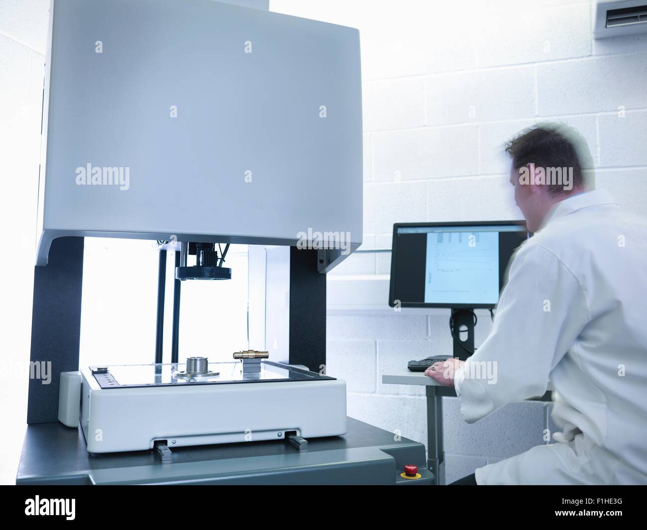 Engineer measuring parts in quality control room Stock Photo Alamy