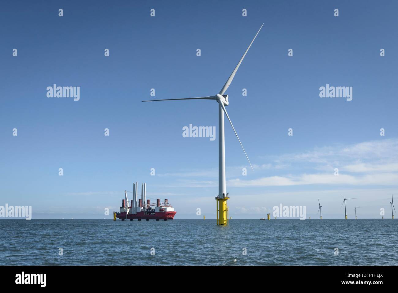 View of offshore windfarm and construction ship from service boat Stock Photo