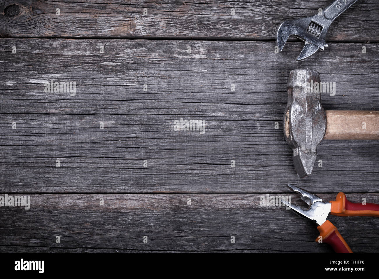 Different construction tools on a wooden background with copy space ...