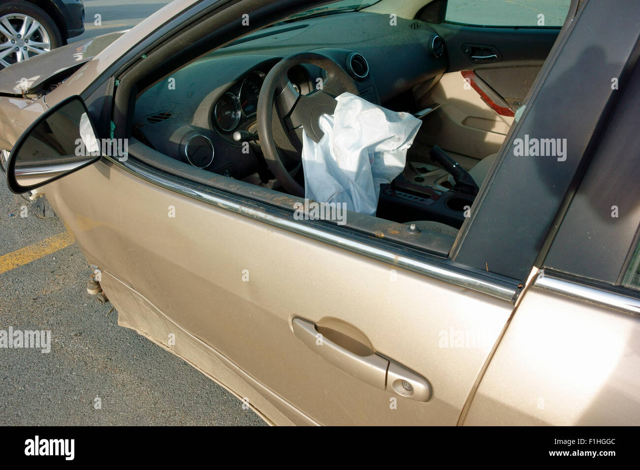 A car vehicle highway accident showing the driver's side steering wheel airbag that has been activated or inflated Stock Photo