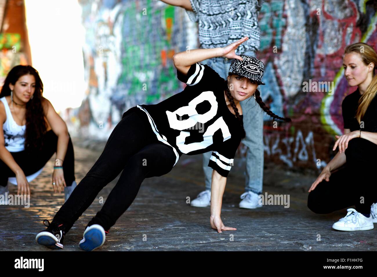 Young woman breakdancing Stock Photo