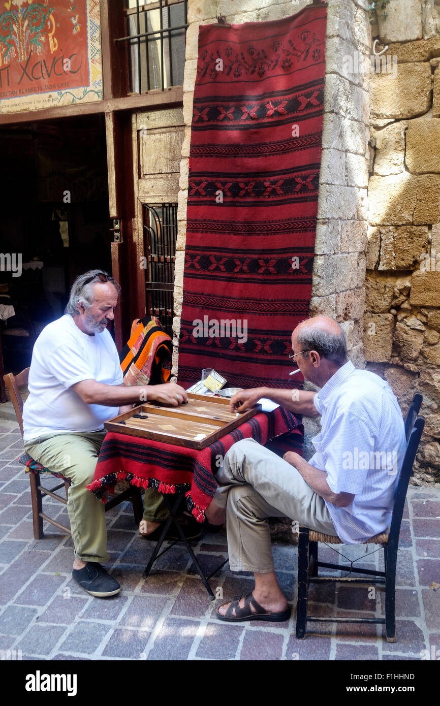 Men Playing Tavli, Chania Old Town, Crete, Greece Stock Photo