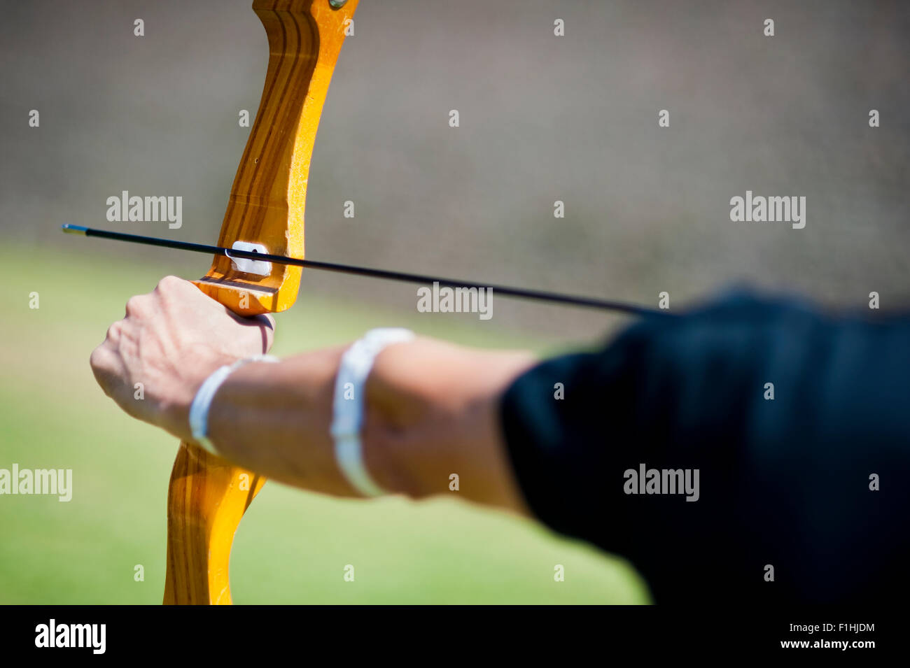 Archer holding a bow aiming at a target Stock Photo Alamy