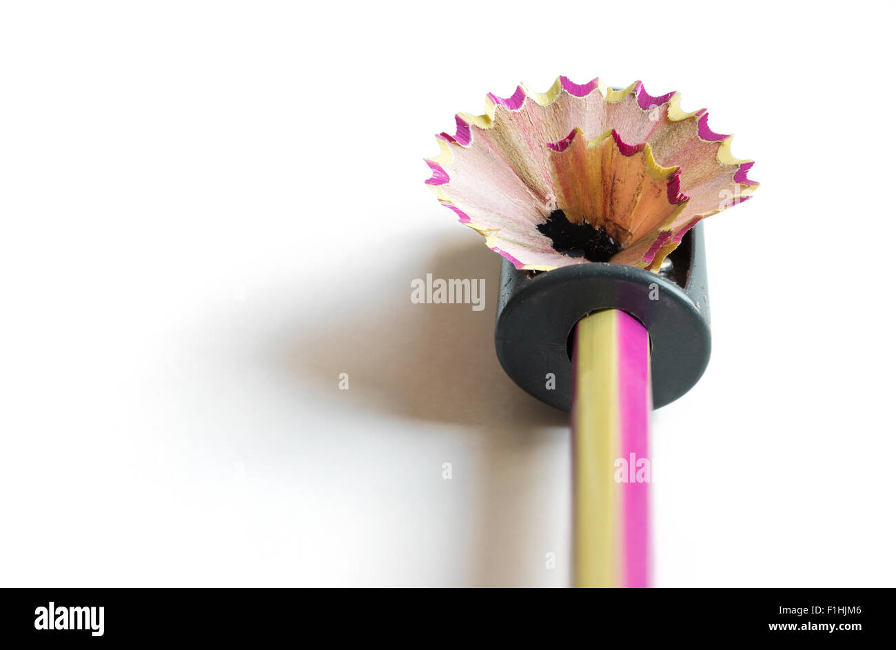 pencil with sharpening shavings on white background Stock Photo