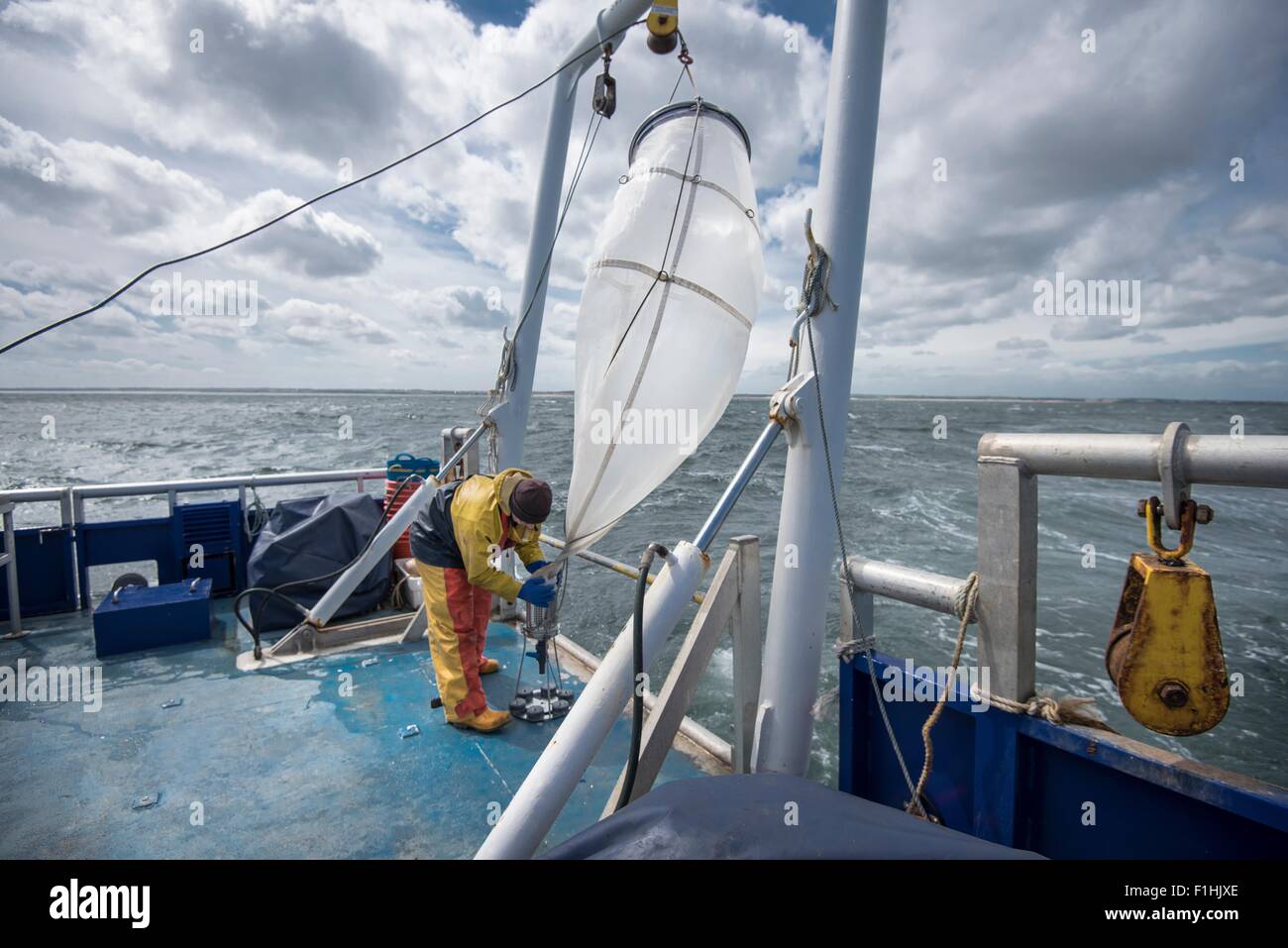 Scientist preparing plankton net on research ship Stock Photo