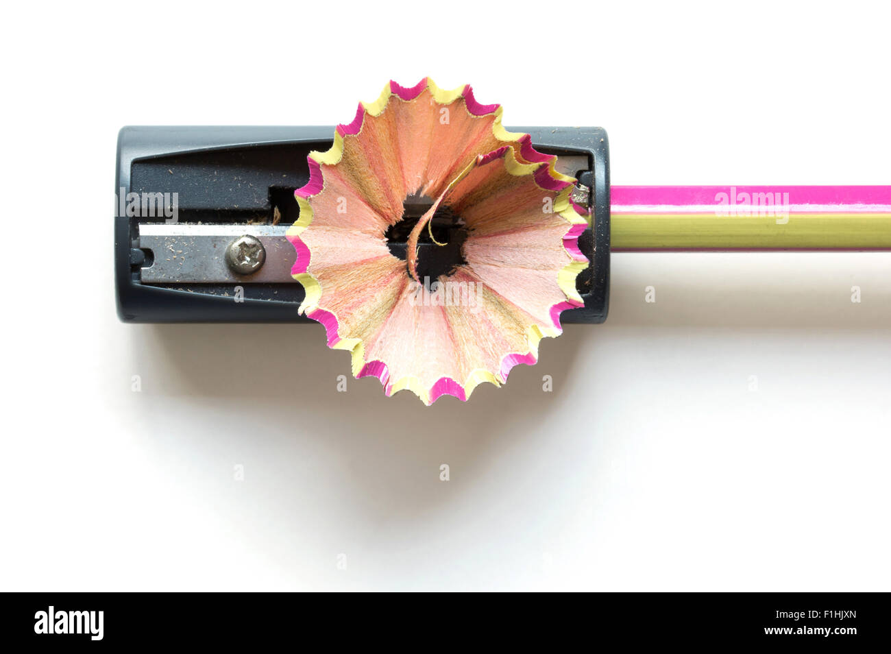 pencil with sharpening shavings on white background Stock Photo
