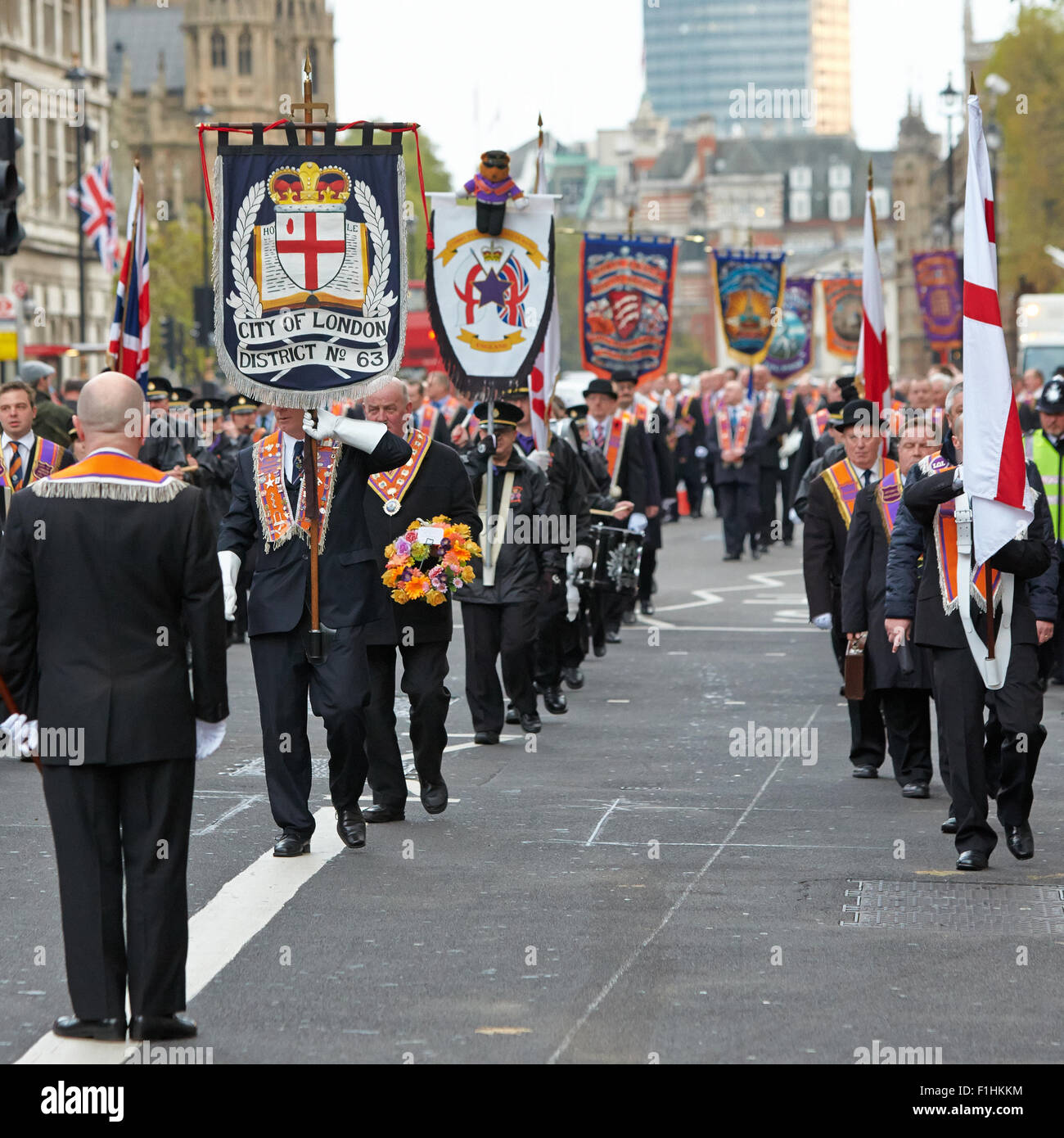 Members of the Orange Order London District march past the Cenotaph on