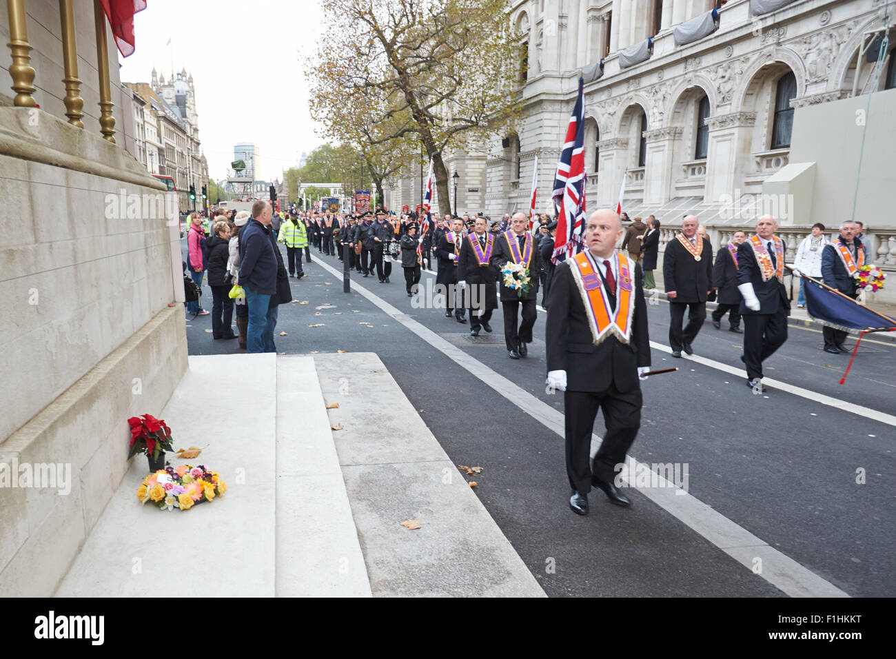 Members of the Orange Order London District march past the Cenotaph on