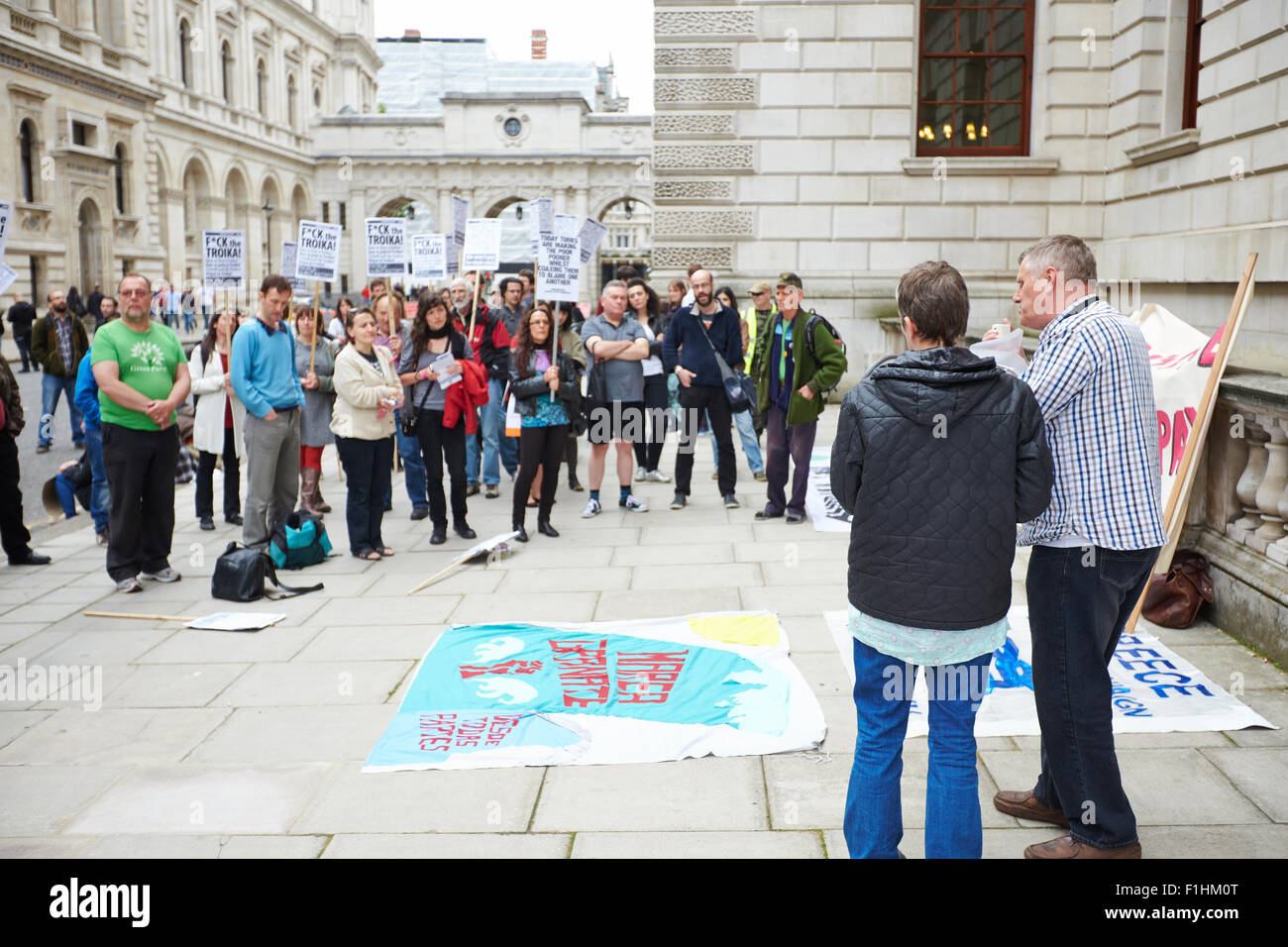 People gather outside the Foreign Office in London to protest against austerity measures Stock Photo