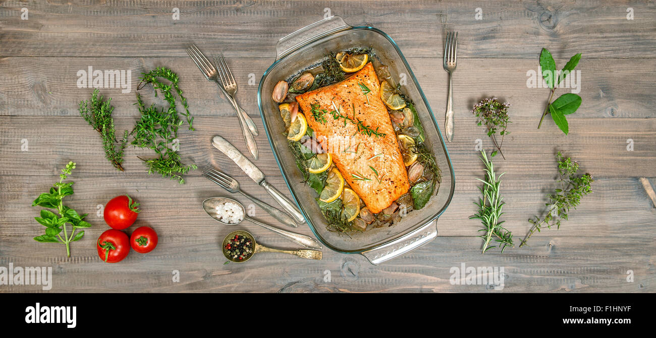 Baked salmon trout fish with fresh herbs and spices. Healthy food