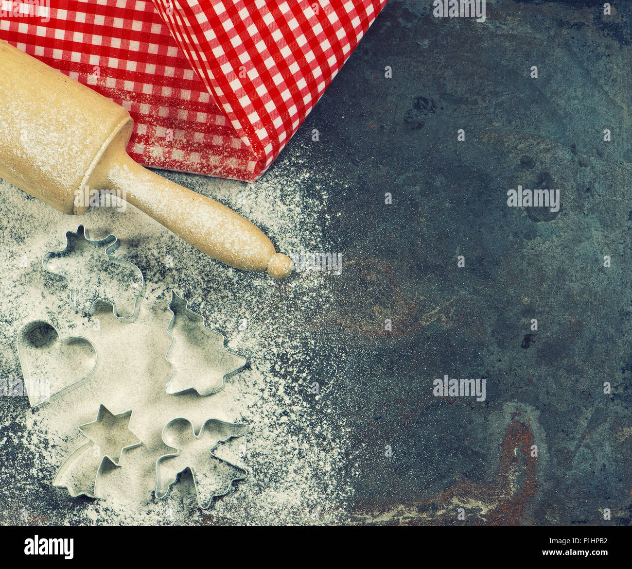 Cookie cutters, rolling pin and flour. Christmas food. Festive baking concept. Stock Photo