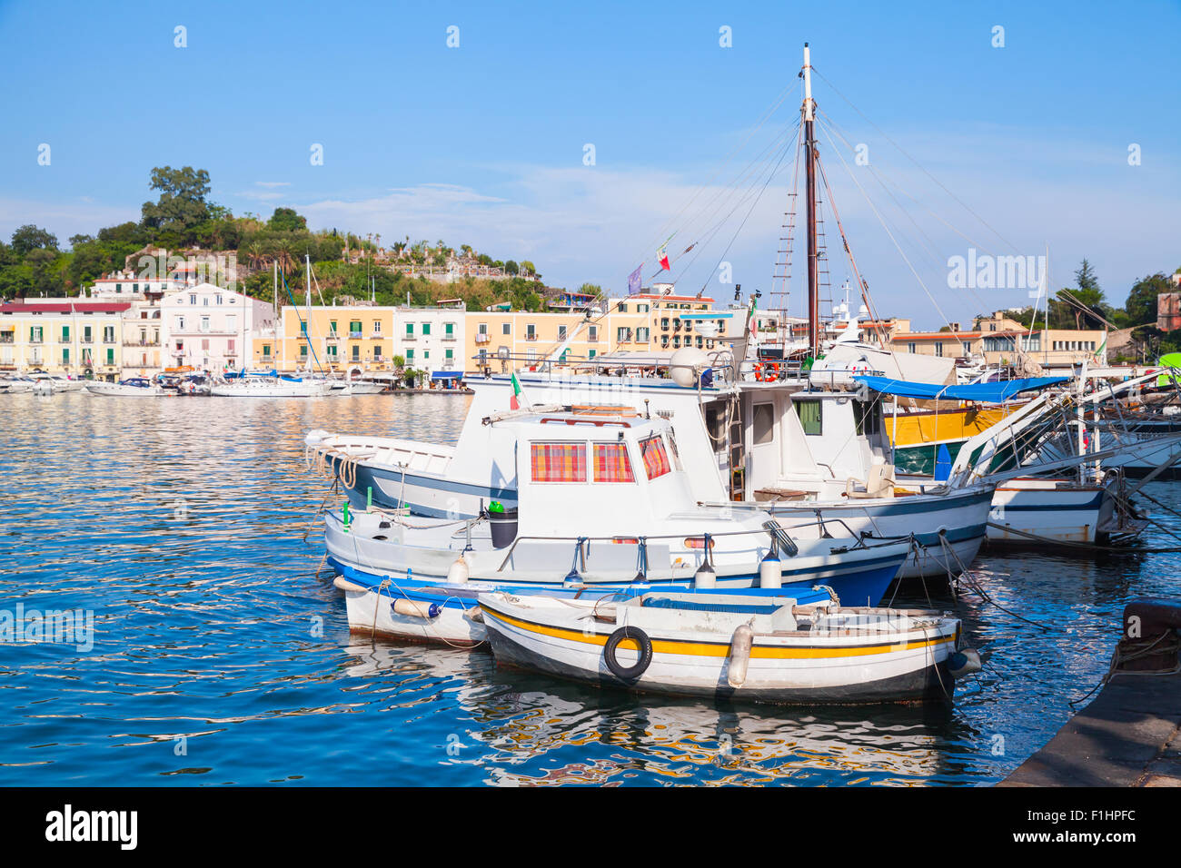 Moored small fishing boats in old Ischia port, Italy Stock Photo
