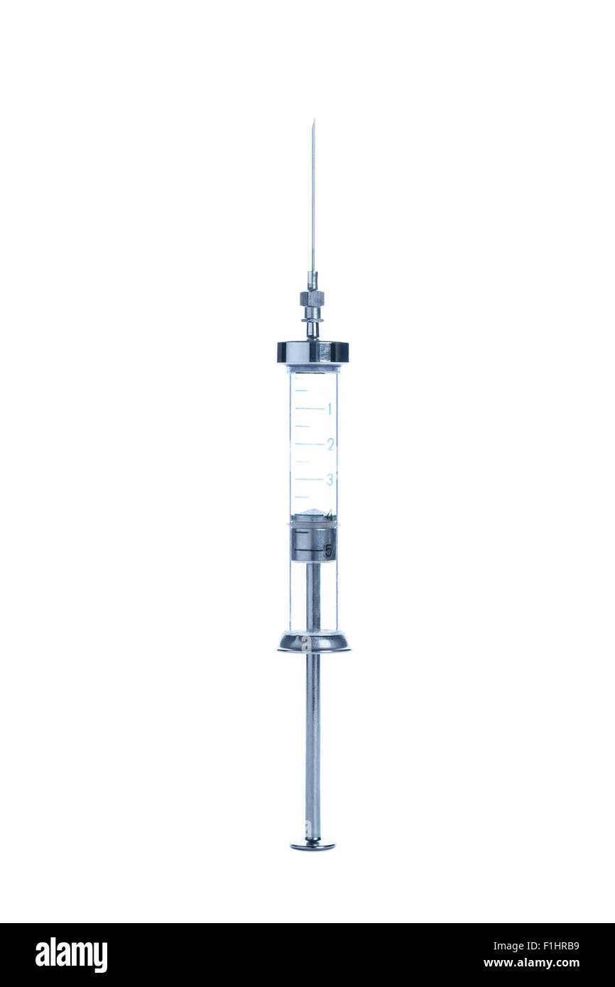 Old glass multiple use syringe with needle, closeup on white background Stock Photo