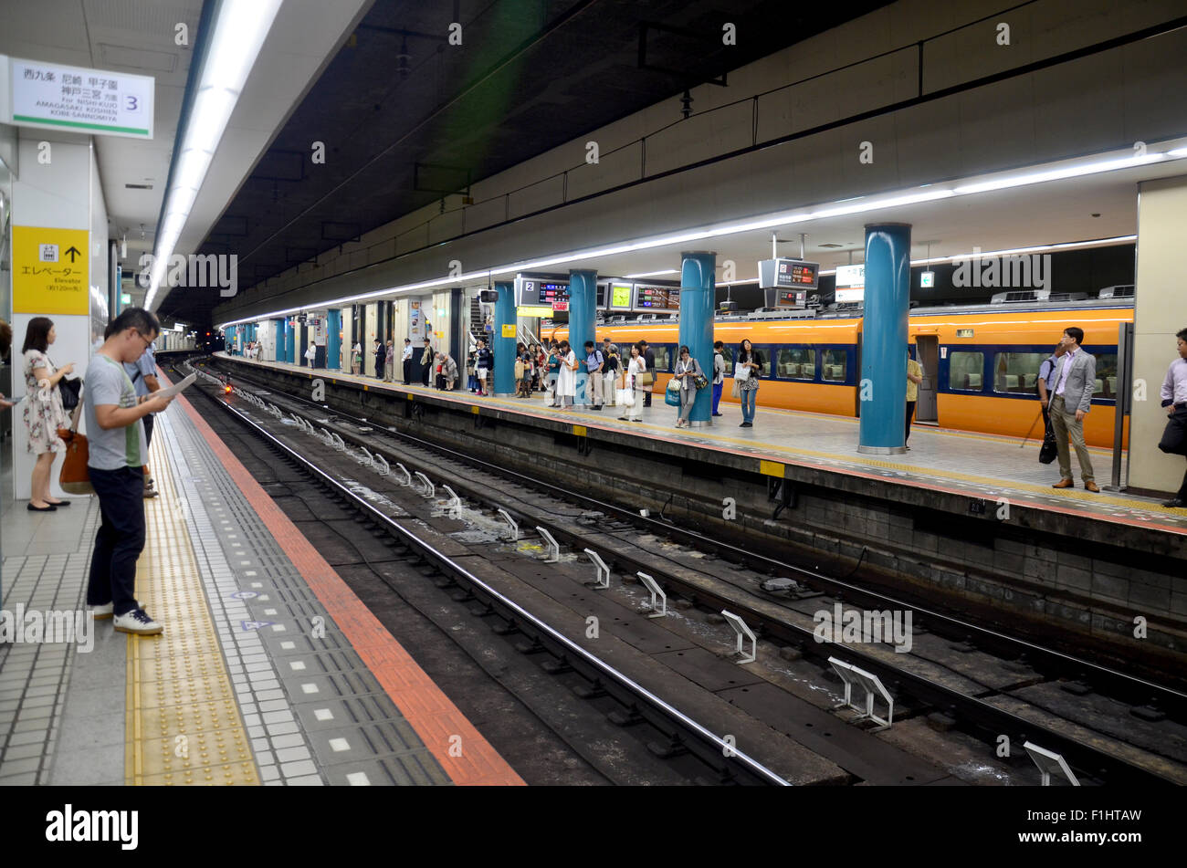 People waiting subway train Kintetsu Nara station on July 9, 2015 in Nara, Japan Stock Photo