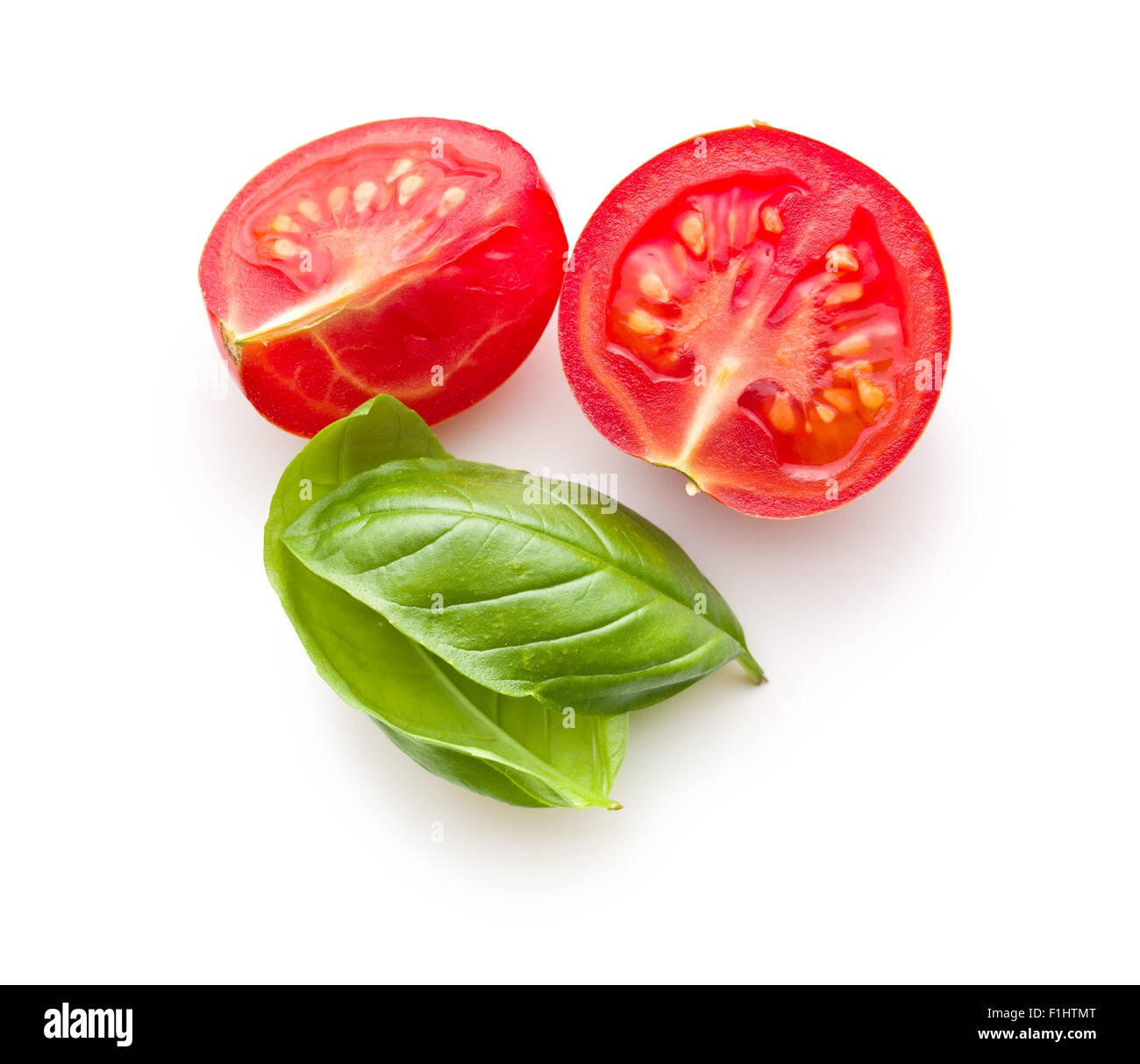 chopped tomatoes and basil leaf on white background Stock Photo - Alamy