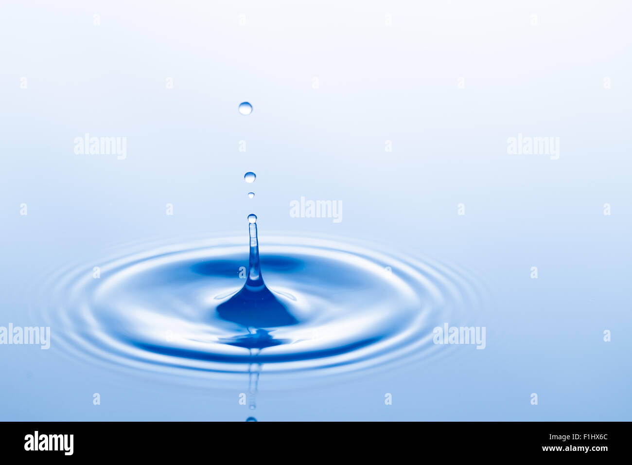 Falling water drop and splash Stock Photo Alamy