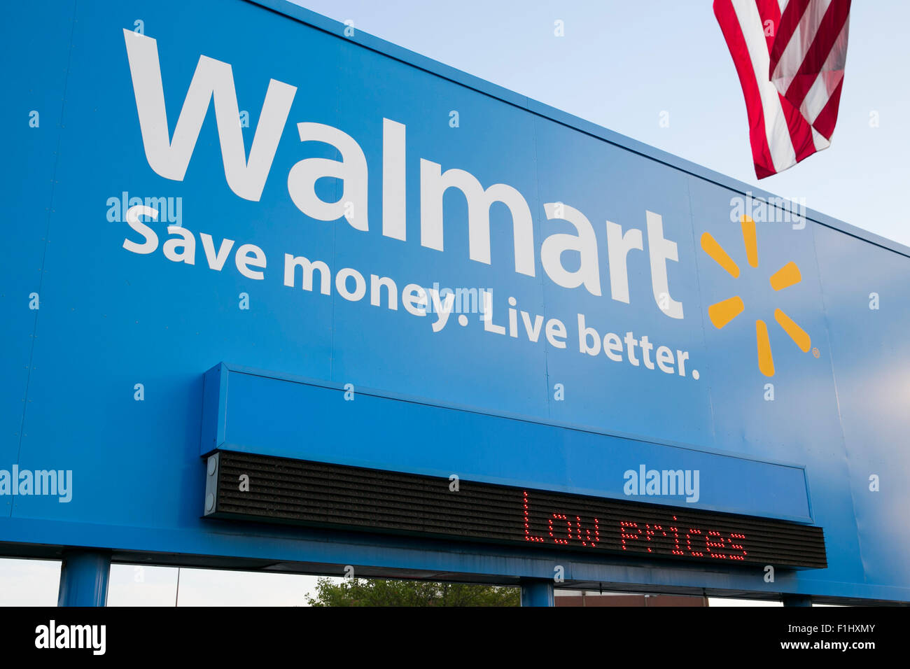 A logo sign outside of the Walmart headquarters, known as the Home