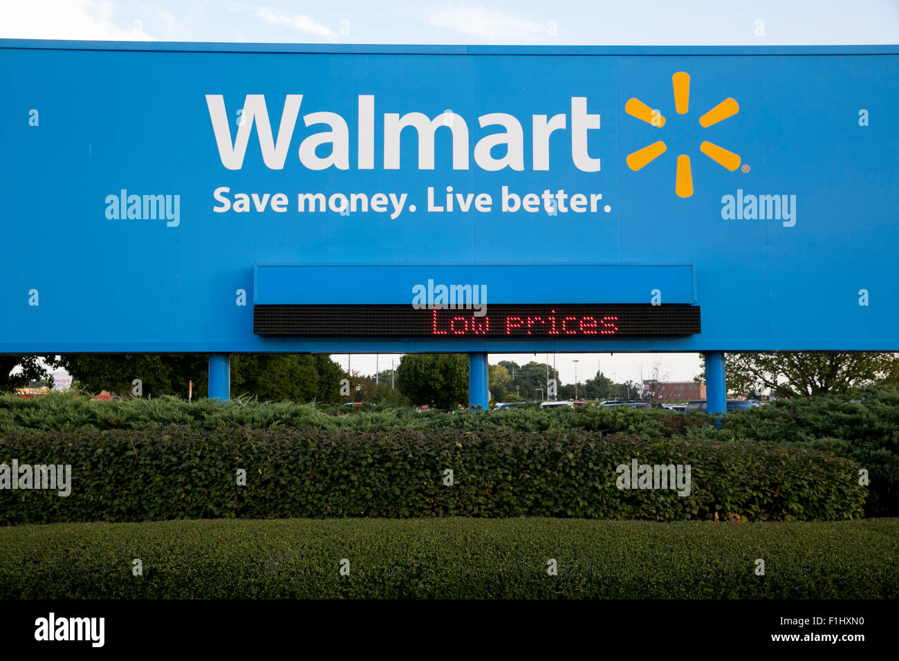 A logo sign outside of the Walmart headquarters, known as the Home