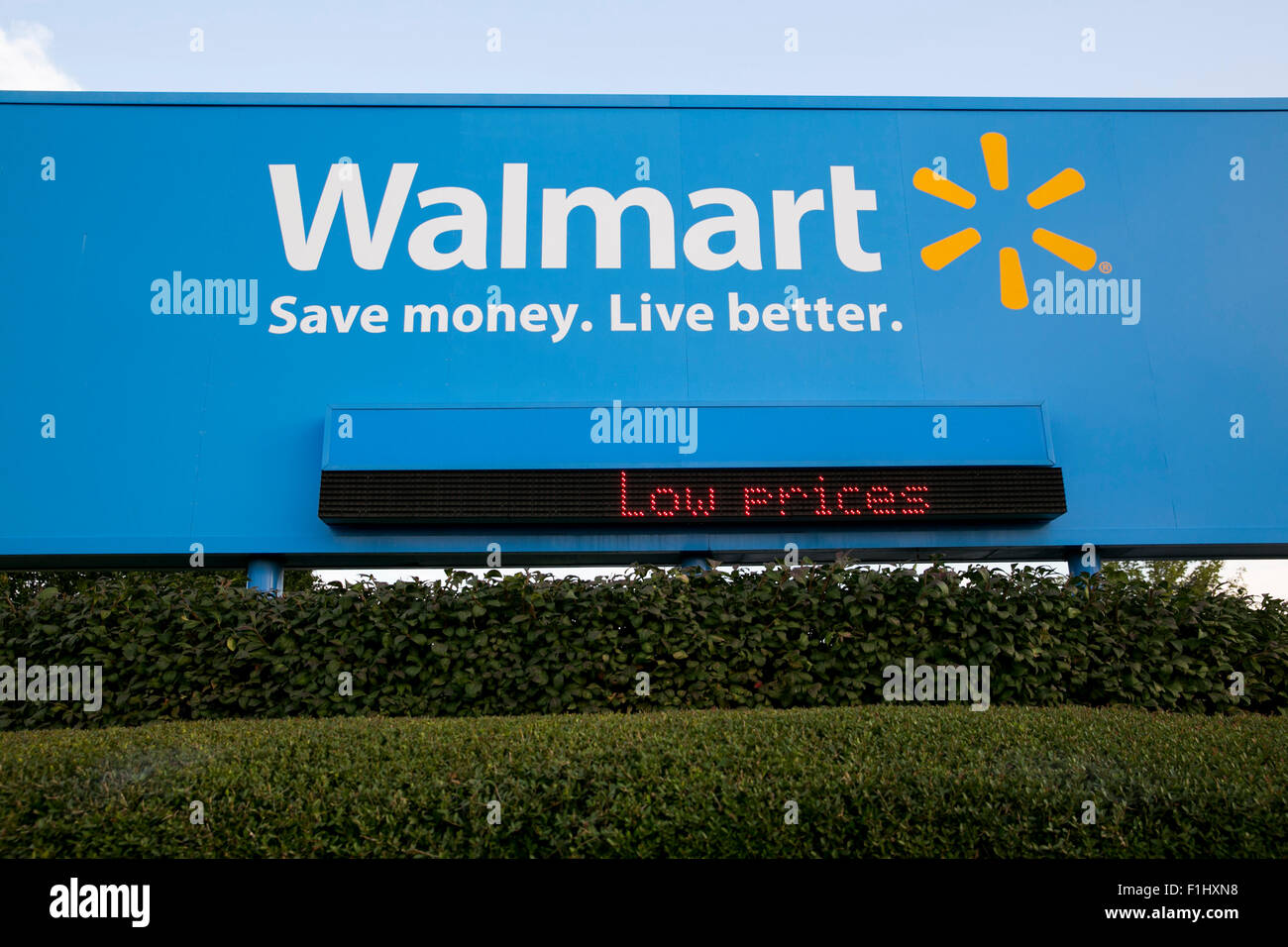 A logo sign outside of the Walmart headquarters, known as the Home