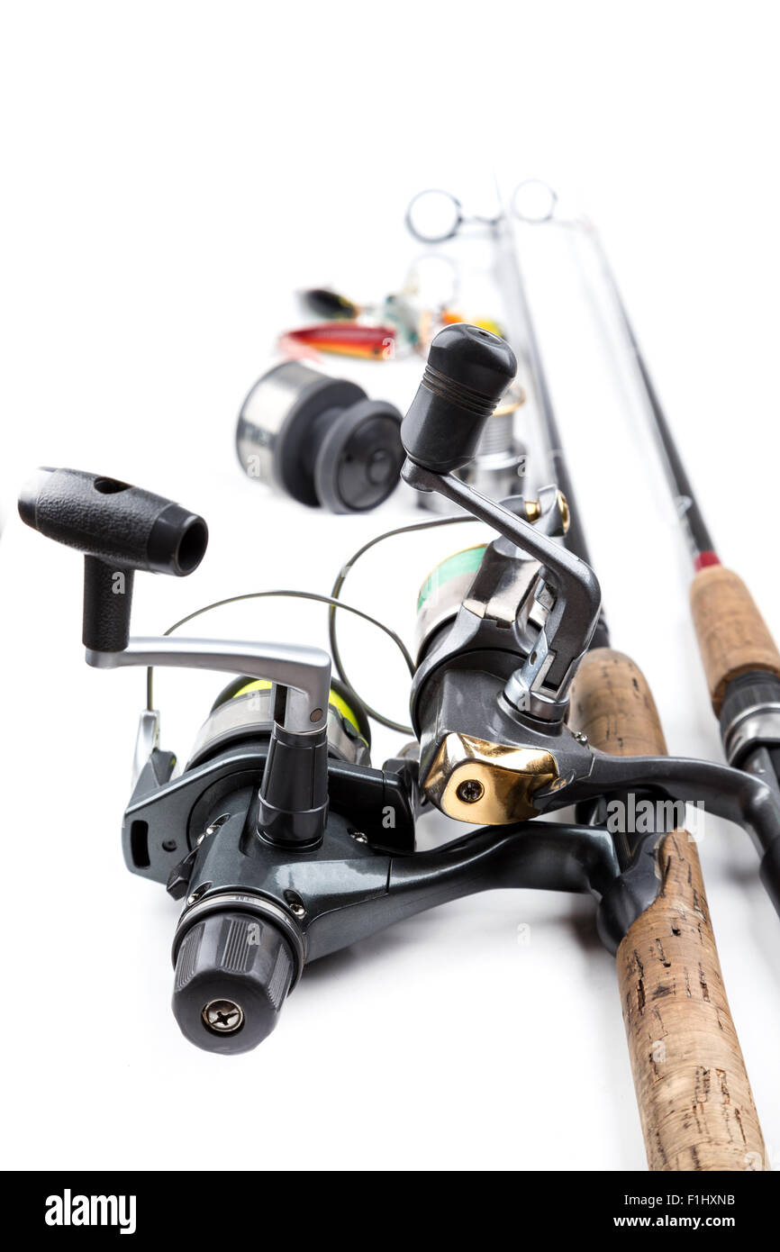different fishing tackles - rod, reel, line and lures on white background Stock Photo