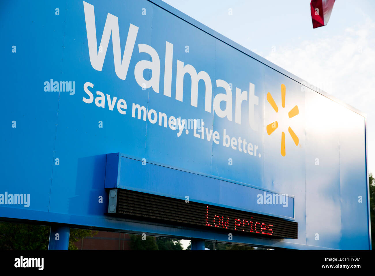A logo sign outside of the Walmart headquarters, known as the Home