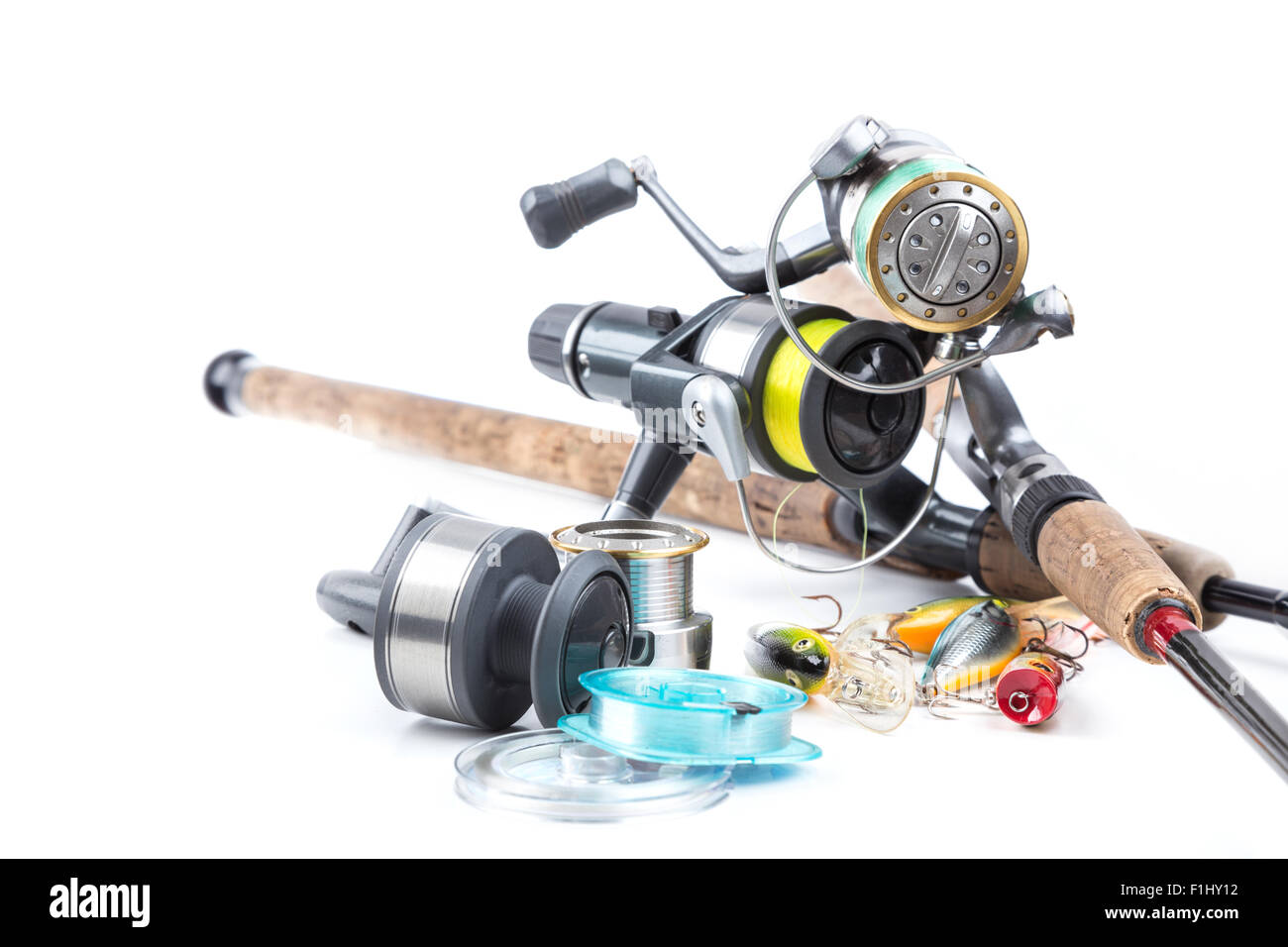 different fishing tackles - rod, reel, line and lures on white background Stock Photo
