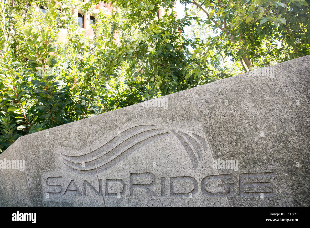 A logo sign outside of the headquarters of SandRidge Energy, in Oklahoma City, Oklahoma, on August 20, 2015. Stock Photo