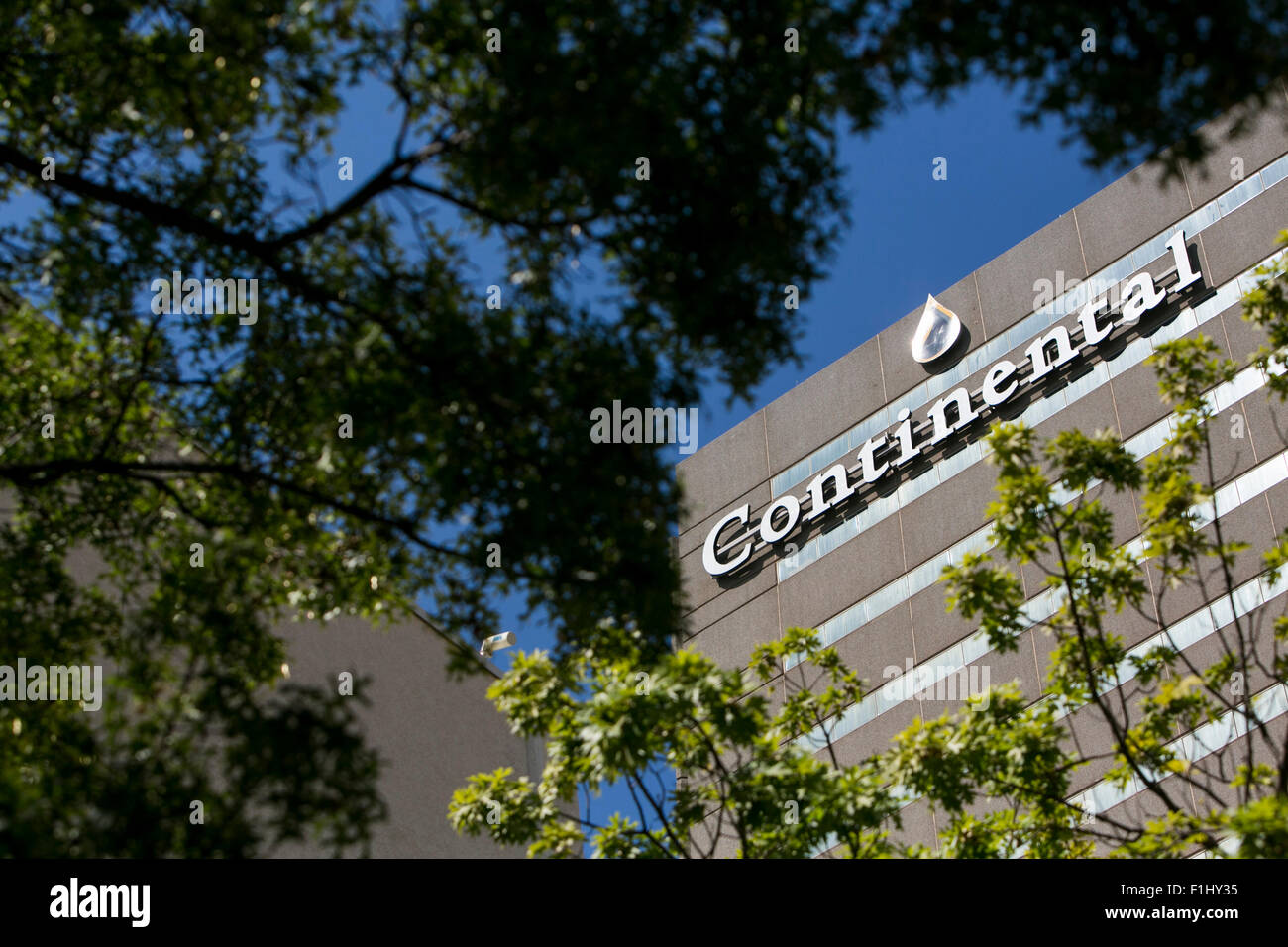 A logo sign outside of the headquarters of Continental Resources, Inc