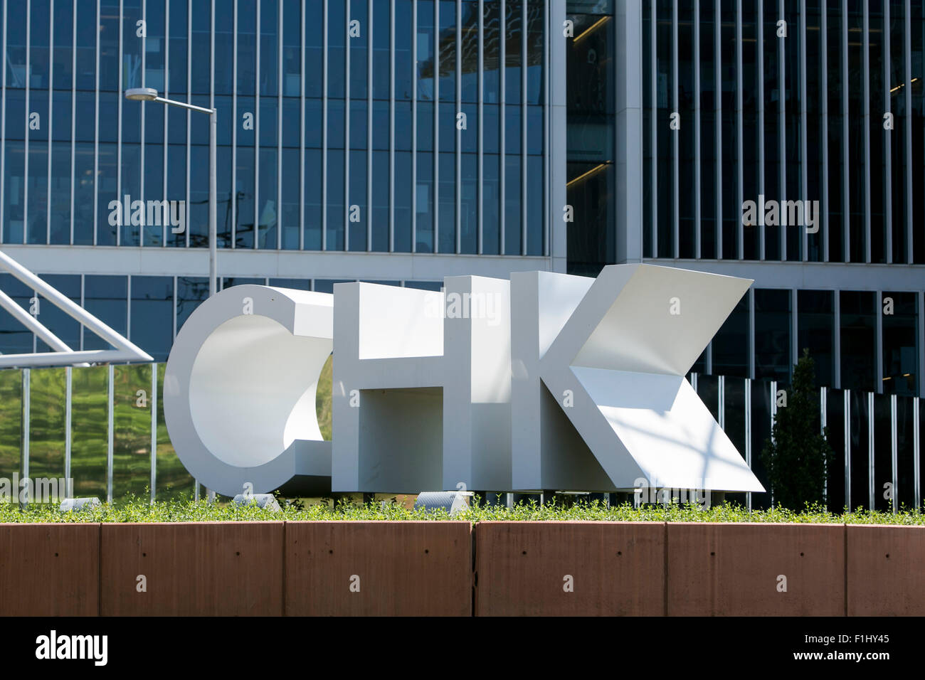 A logo sign outside of the headquarters of the Chesapeake Energy Corporation, in Oklahoma City, Oklahoma, on August 20, 2015. Stock Photo