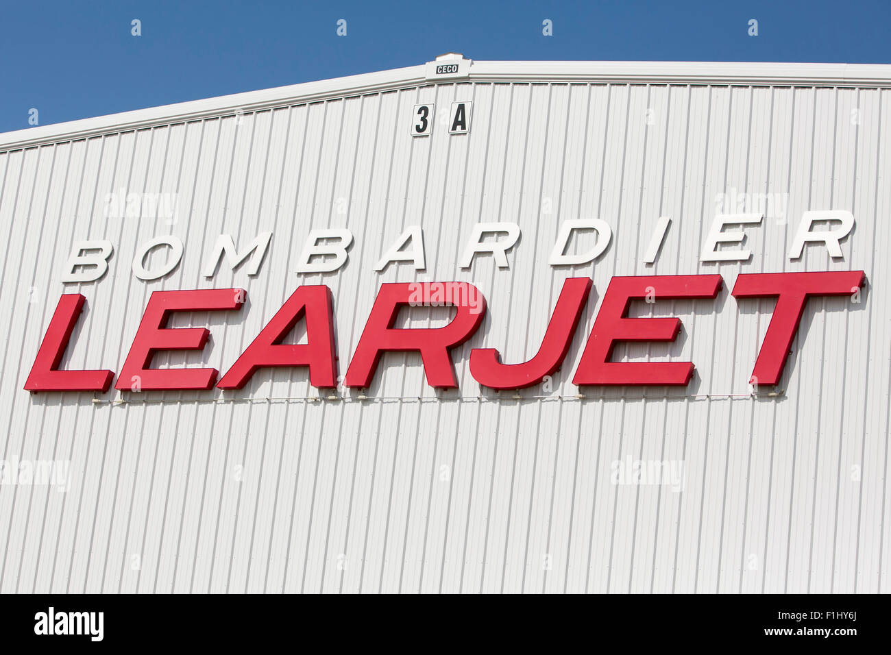 A logo sign outside of the headquarters of the Bombardier Learjet Corporation in Wichita, Kansas, on August 22, 2015. Stock Photo