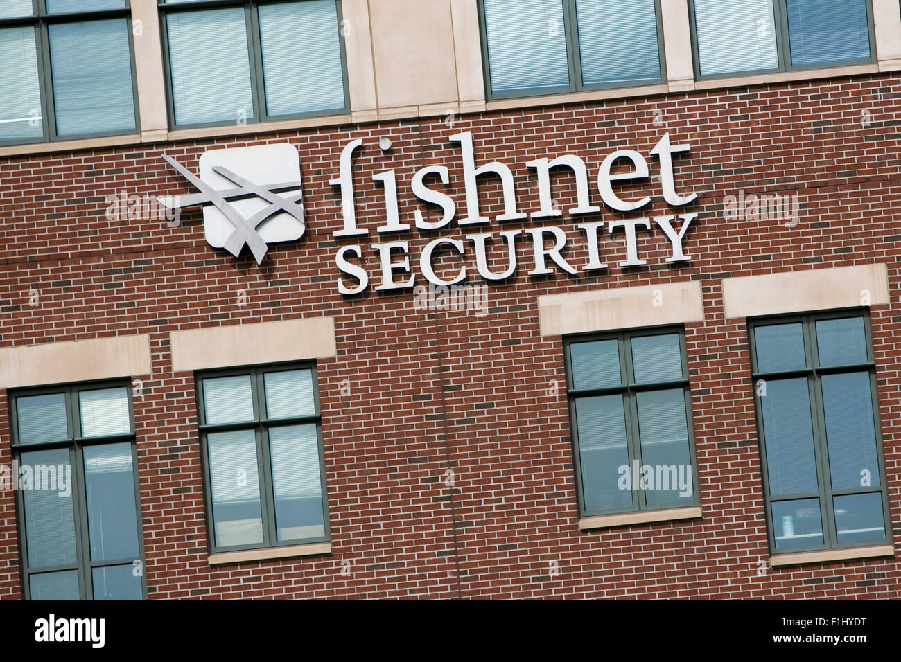 A logo sign outside of the headquarters of FishNet Security Inc., in Overland Park, Kansas on August 23, 2015. Stock Photo