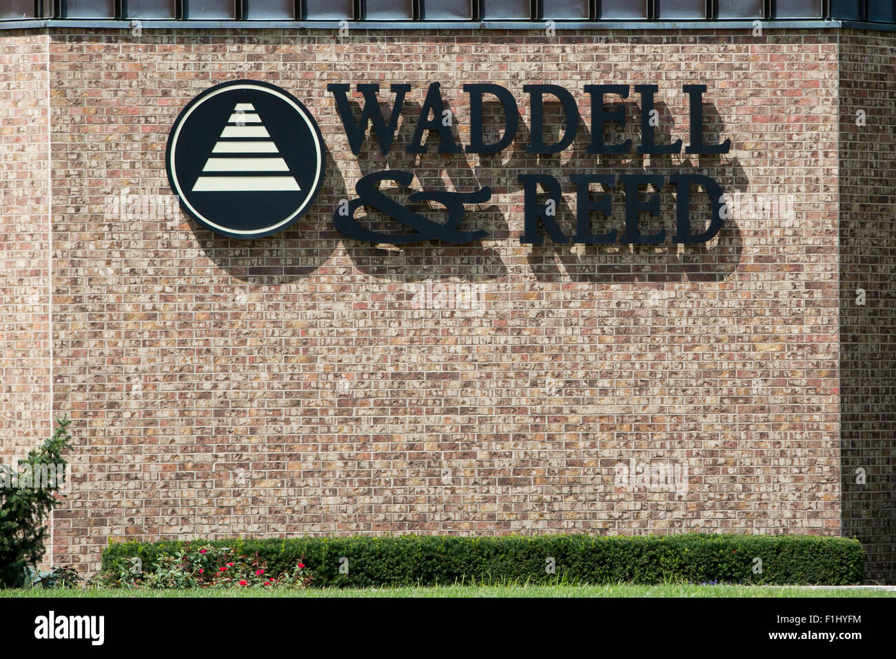 A logo sign outside of the headquarters of Waddell & Reed Financial
