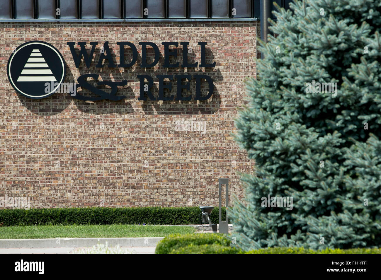 A logo sign outside of the headquarters of Waddell & Reed Financial