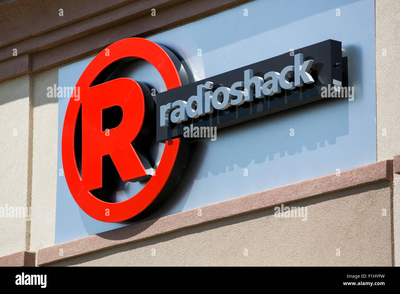 A logo sign outside of a joint Sprint and Radioshack store in Kansas City, Kansas on August 23, 2015. Stock Photo