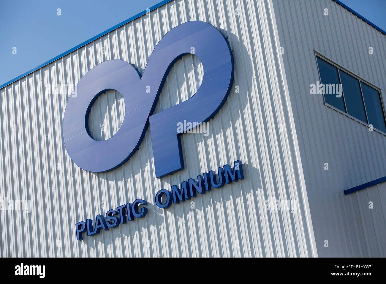 A logo sign outside of a facility occupied by Plastic Omnium in Kansas City, Kansas on August 23, 2015. Stock Photo
