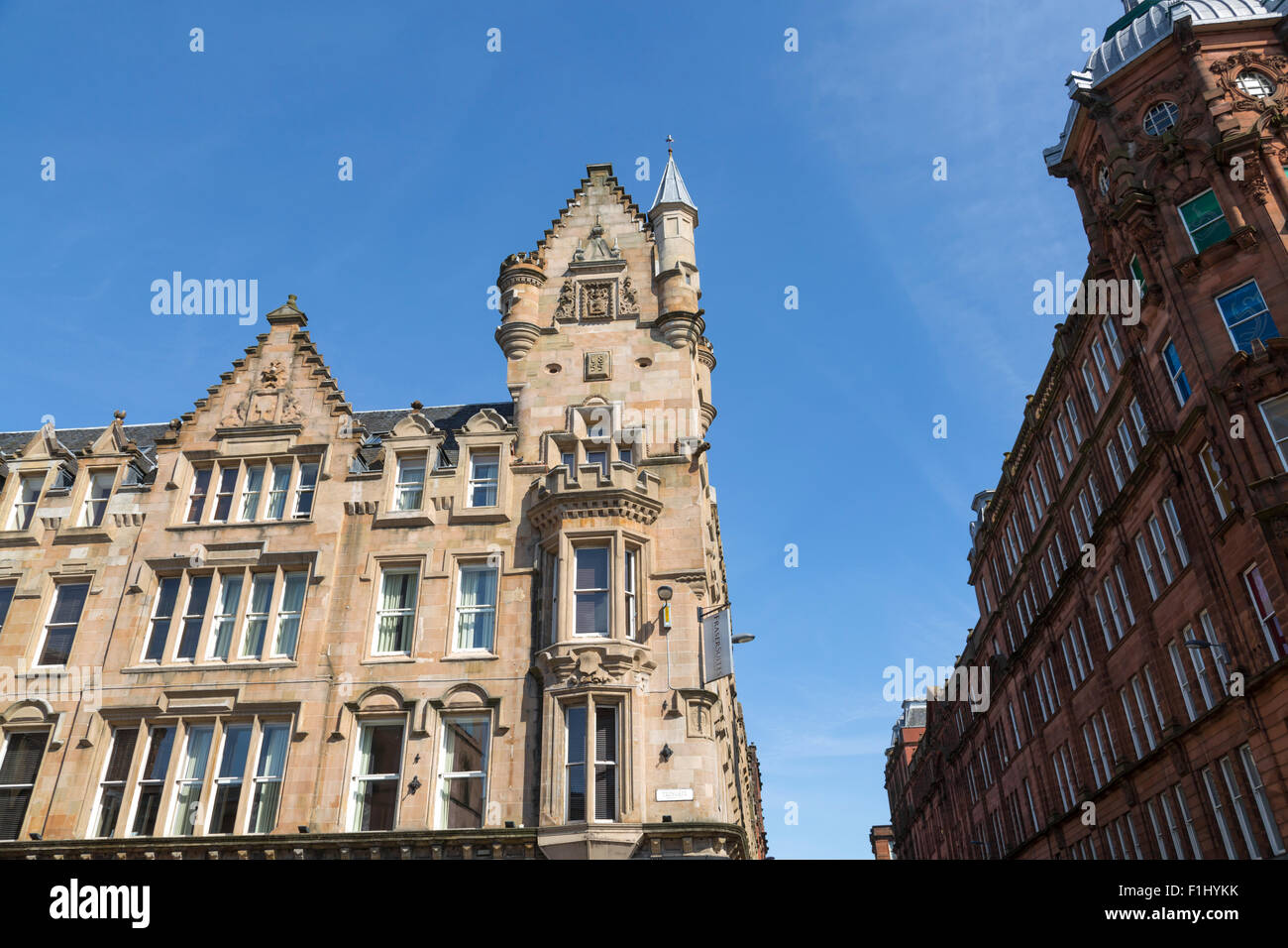 Merchant City Glasgow. Detail of City Bank building built in 1850's, now houses Fraser Suites Serviced Apartments / Hotel, Trongate, Scotland, UK Stock Photo