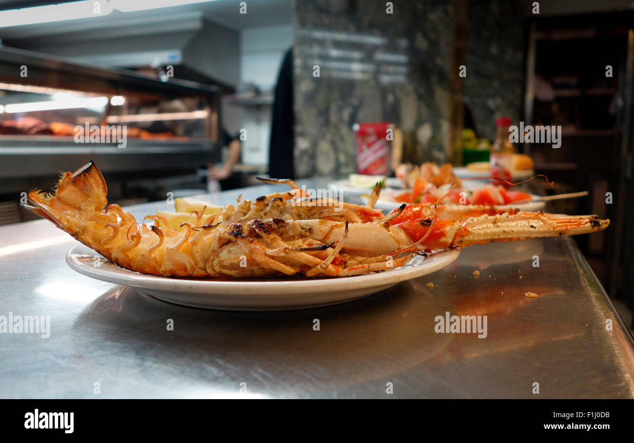 Cigalas, Norway lobster, Dublin Bay prawn, langoustine grilled and served at seafood bar in Torremolinos. Andalusia, Spain. Stock Photo