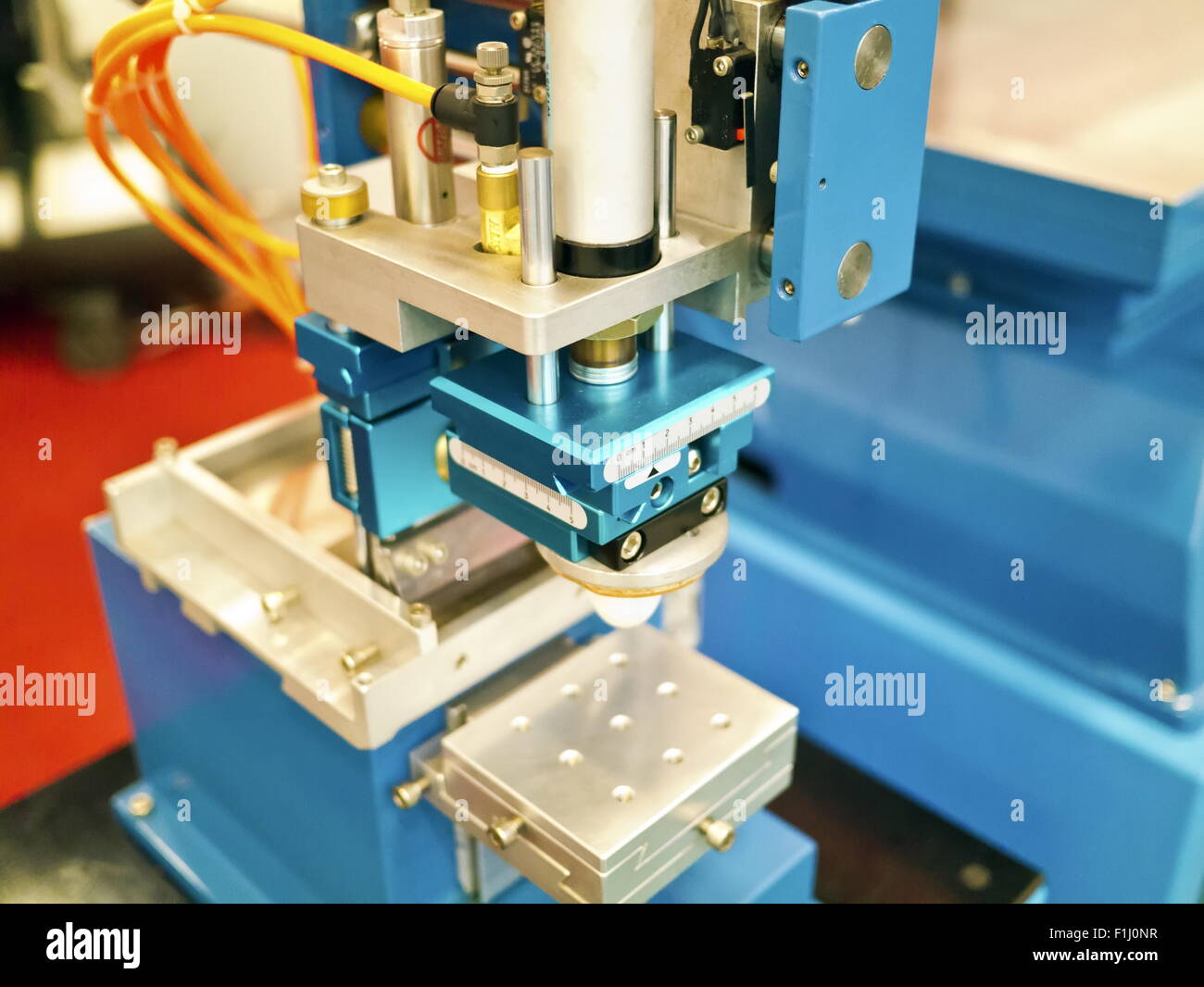 Closeup of printng machine working part with white light Stock Photo