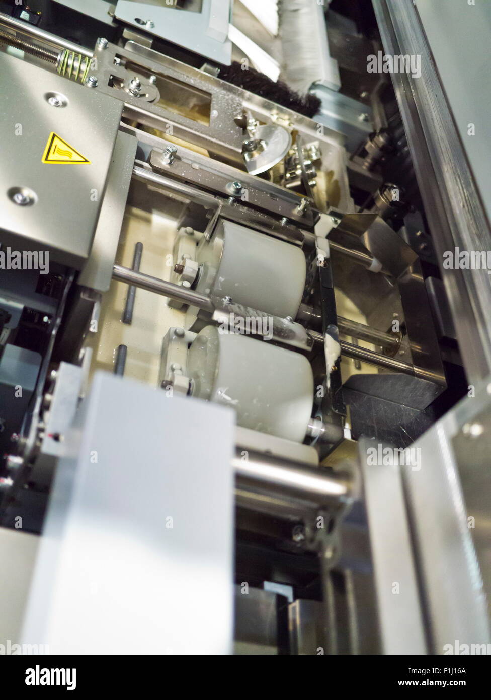 Closeup of printng machine working part with white light Stock Photo